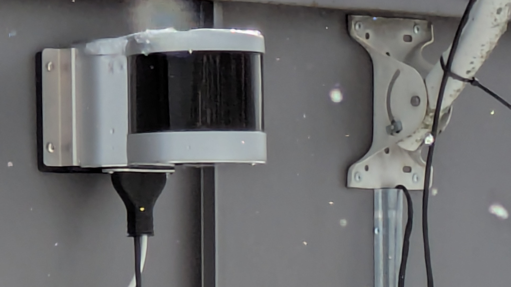 Optical Link mounted to an wall on a roof of a building